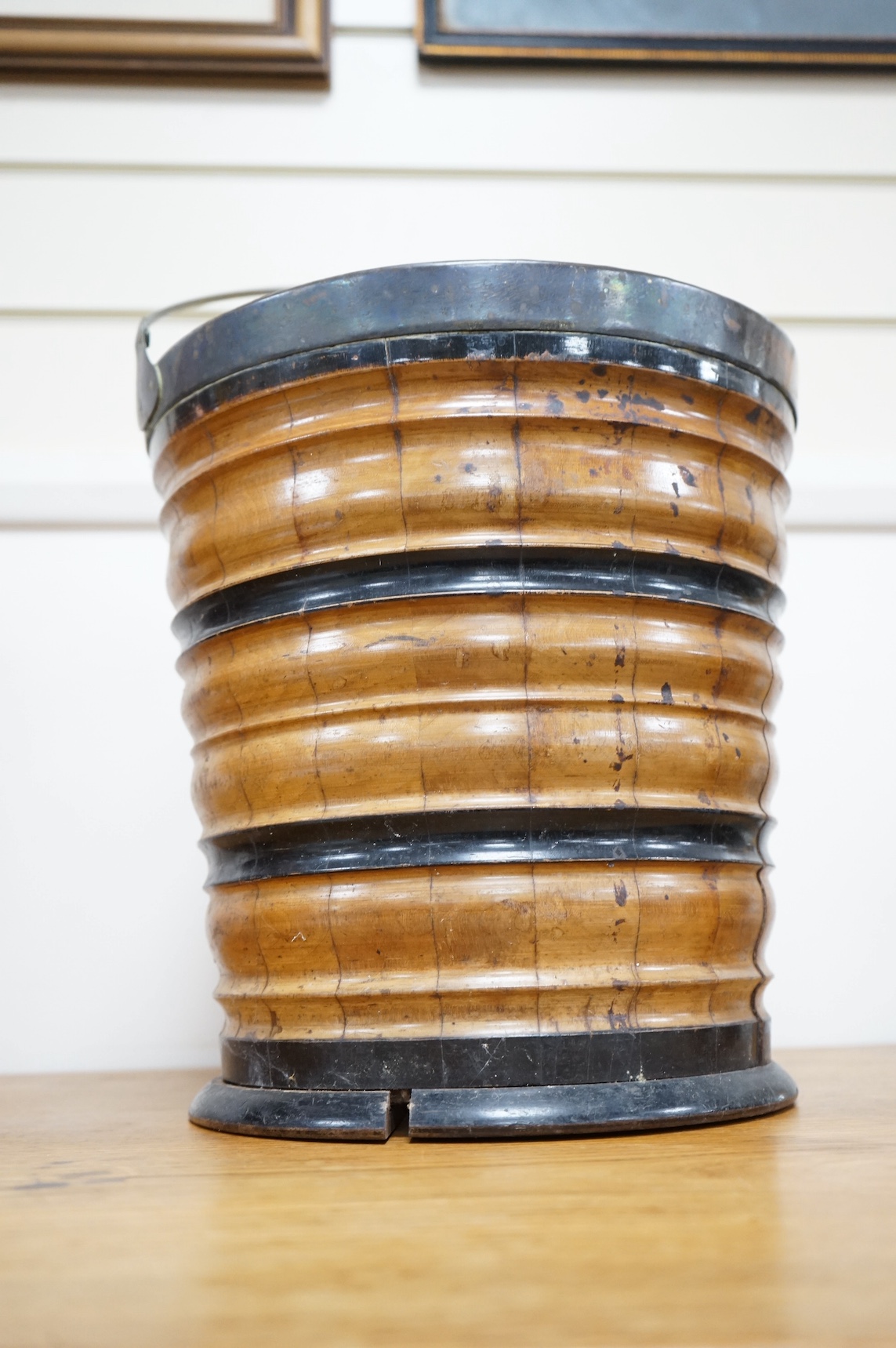 A 19th century Dutch oyster bucket with swing handle, 31cm high. Condition - some splits
